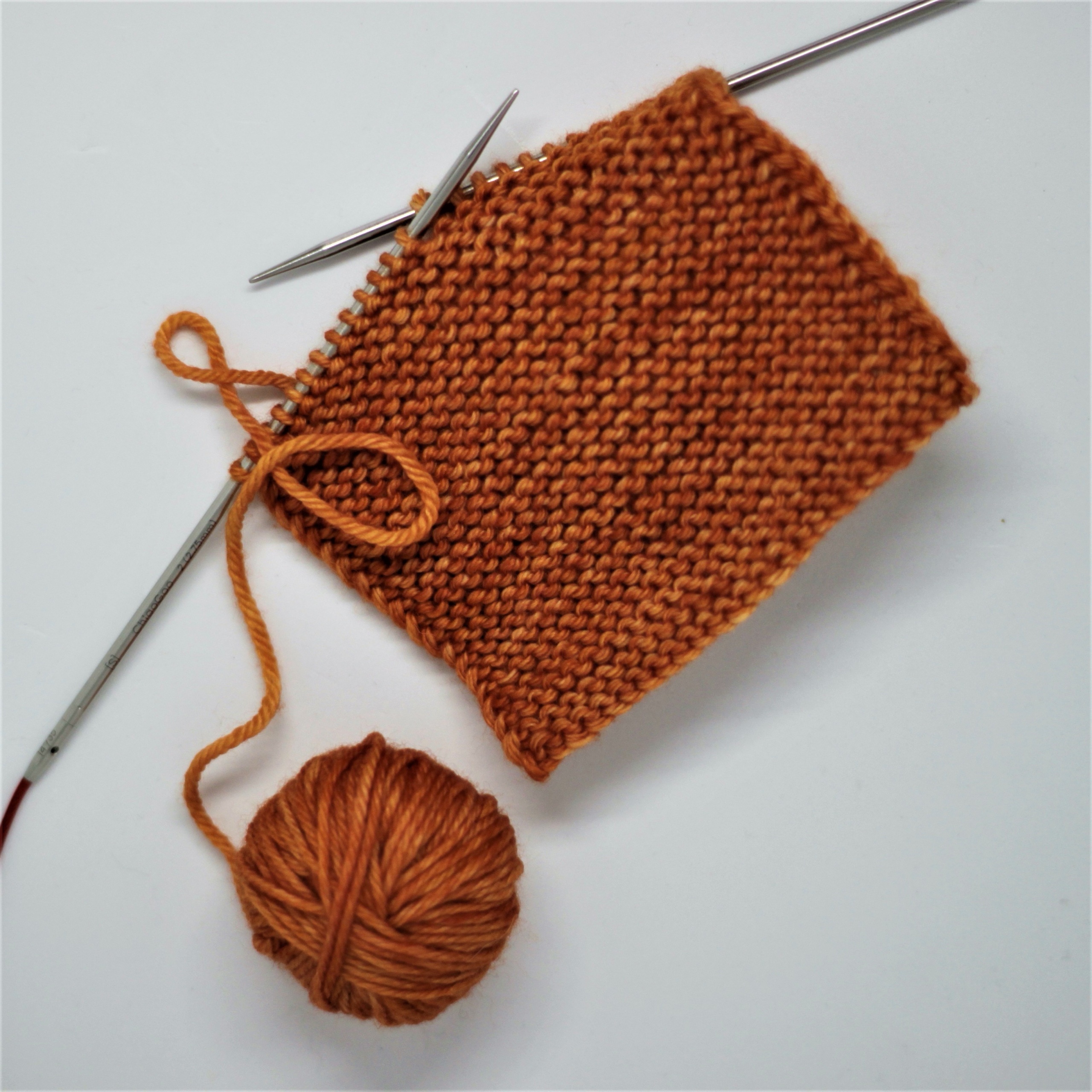 Knitting project with orange yarn